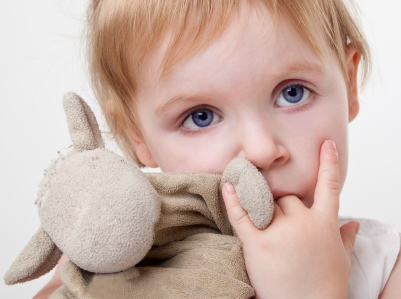 Child holding teddy bear