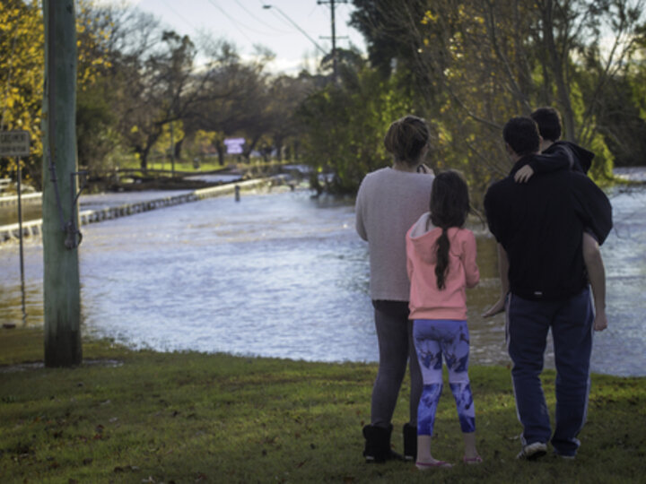 family looking at flood